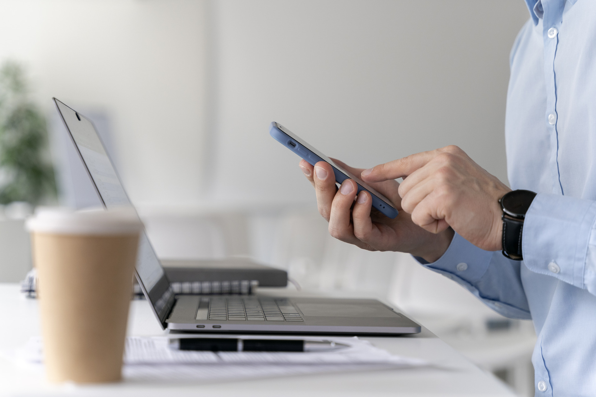 young-business-man-working-her-desk-with-laptop-smartphone (1).jpg